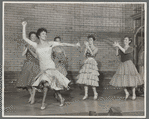 Chita Rivera [foreground] and Shark girls perform "America" in the stage production West Side Story