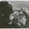 View of two women mourners, actress Shelly Winters on right and, possibly, actress Rita Moreno at left, attending the funeral for playwright Lorraine Hansberry