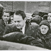 Robert Nemiroff, ex-husband of playwright Lorraine Hansberry, standing outside with others during blizzard at the funeral for Hansberry, held at the Presbyterian Church of the Master, in Harlem, New York
