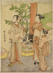 A man and his wife and daughter standing beneath a torii watching the flight of a bird and setting free another, with green plumage, which the woman holds in her hand.  By the torii a cage of similar birds and traps for ensnaring them