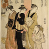 Three women and a small boy on their way to a Shinto temple, passing  by the red post of the torii
