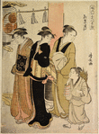 Three women and a small boy on their way to a Shinto temple, passing  by the red post of the torii