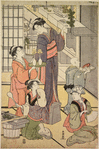Group of women in the kitchen of a house preparing New Year's Day refreshments