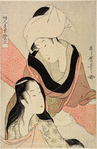 A woman stretching spotted crepe (kanoko) and talking to another woman with her hair down who is seated beside her