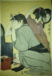 Two women at toilet, engaged in dressing their hair