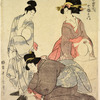 Two women dressing a youth for a game of football