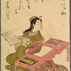 Lady seated at table with books and brushes, book in hand