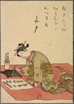 Lady kneeling on rug, writing