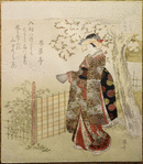 Woman in elaborate kimono in garden under flowering tree, fan in hand