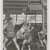 Pop Gates (at center in light color uniform) of the Dayton Rens, during a basketball game against the Anderson Packers