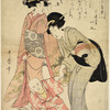 Two women walking with a small boy