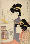 Two women looking at a whirling lantern