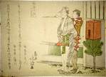Two men walking, one carrying a box