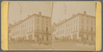 Street view of hotel building with group of men standing next to horse and carriage, Ohio