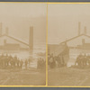 A group of young boys and onlookers in front of houses in water, Ohio