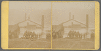 A group of young boys and onlookers in front of houses in water, Ohio
