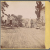 Street view of dirt road flanked by houses on each side, Richmond, Ohio