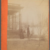 The Great Flood of Februrary 7, 1884 [man and woman standing next to a house overlooking the water], Steubenville, Ohio