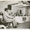 Dr. Martin Luther King, Jr., center, addressing a group of Harlem ministers in preparation for the Prayer Pilgrimage for Freedom to Washington, D.C