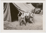 Donald Saddler and Jerome Robbins with three male dancers outside tent