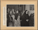In a corner of the church during Easter Mass, under a banner reading “Sisterhood of the Virgin Mary”, Gypsies stand with unaccustomed reverence, to watch proceedings