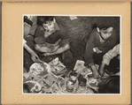 Roma children eating baked beans