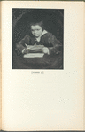 A boy holding a pen 