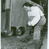 Gene Kelly on the set of The Three Musketeers putting on boot
