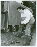 Gene Kelly on the set of The Three Musketeers putting on boot