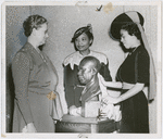 Augusta Savage (center) at the presentation of her bust of author and activist James Weldon Johnson