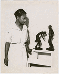 Augusta Savage with two of her statuettes, entitled (left to right) “Susie Q” and Truckin’” 