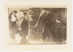 Edna Purviance, Charlie Chaplin and Charles Reisner in the motion picture The Kid