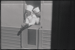 Two men looking out of train window