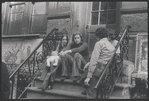 City residents on stoop. New York, NY