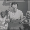 Masked woman and children