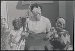 Masked woman and children