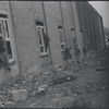 Children in the windows of an abandoned building