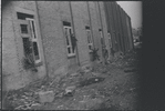 Children in the windows of an abandoned building