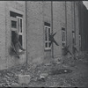 Children in the windows of an abandoned building