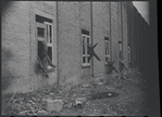 Children in the windows of an abandoned building