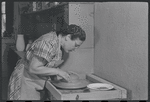 Woman making pottery