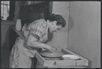 Woman making pottery