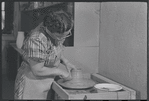 Woman making pottery