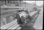 Man sleeping on bench. New York, NY