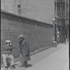 Two men conversing on the street. New York, NY