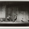 Female dancer stage right with hand out to stop male dancer stage left