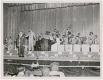Earl Hines and his big band performing at the Apollo Theatre