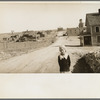 The town of Mills, New Mexico. The grain elevator in background at right has been long ago abandoned. The bank is closed