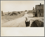 The town of Mills, New Mexico. The grain elevator in background at right has been long ago abandoned. The bank is closed