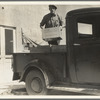 Loading milk at the self-help cooperative dairy which is being taken over by the Resettlement Administration. Near Santa Ana, California
